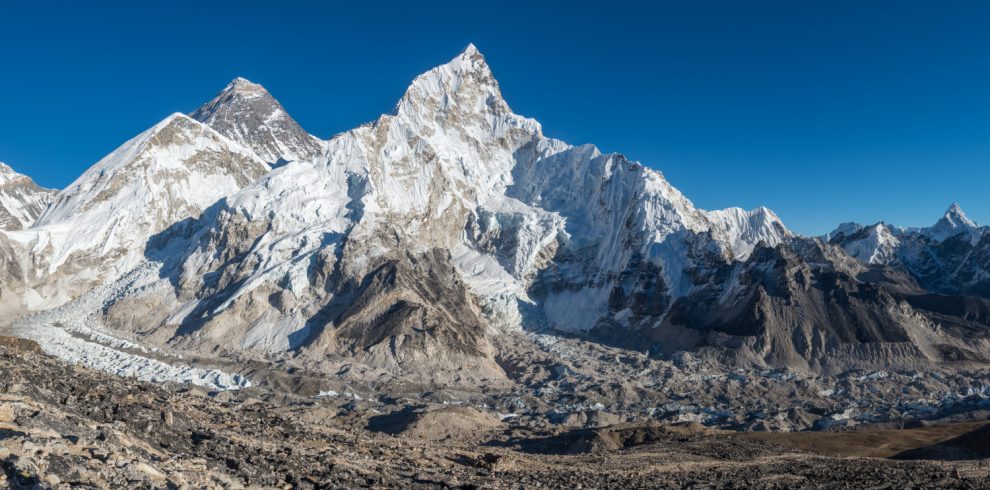 landscape-shot-beautiful-valley-surrounded-by-huge-mountains-with-snowy-peaks