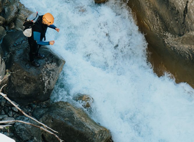 Nepal travel deals beautiful top angle shot people doing extreme sports river ina stony mountain